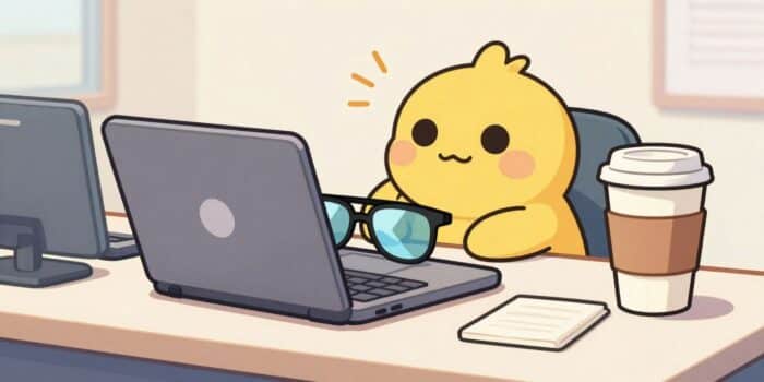 Office desk with sunglasses on a laptop symbolizing a fun out-of-office break.